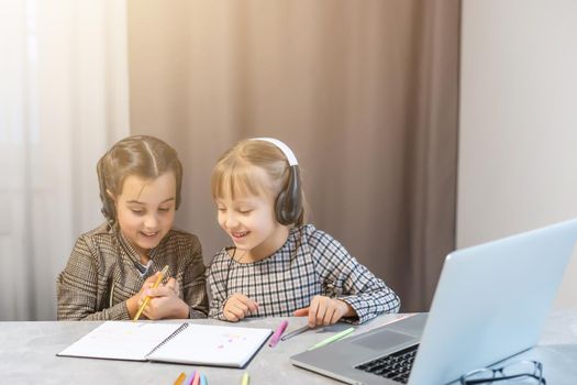 Two little girls doing their school homework