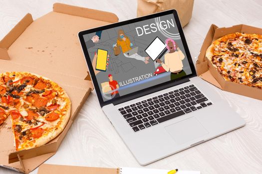 Workplace with laptop on table at home web designer or artist. Concept of a freelance and creative work online