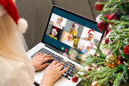 Attractive happy young girl student having video chat, waving. christmas.