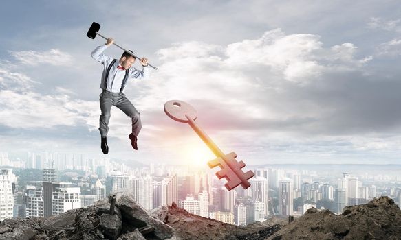 Jumping businessman crashing big key symbol with city view and sunlight on background. 3D rendering.