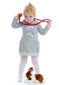 little girl.Two-year-old girl with beads.Isolated on white background.