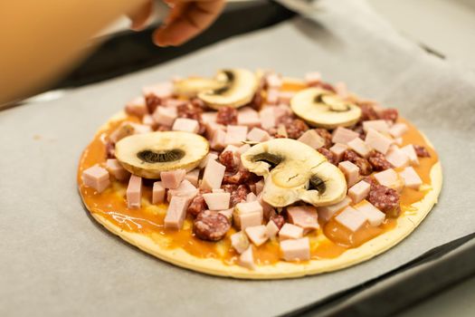 child cook homemade pizza, little girl makes pizza at home