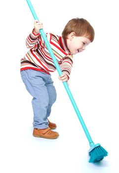 Little boy sweeping the floor with a brush.Isolated on white background portrait.
