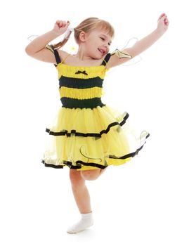 Little girl in a beautiful yellow dress isolated on white background.Happy childhood, adolescence, the development of the family concept.