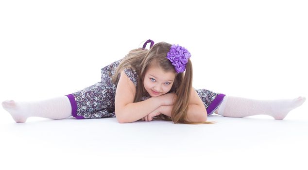 girl, sport, exercise, and twine.- A beautiful young girl sits on a twine. isolated on white background.