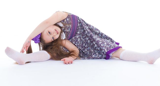 girl, sport, exercise, and twine.- A beautiful young girl sits on a twine. isolated on white background.