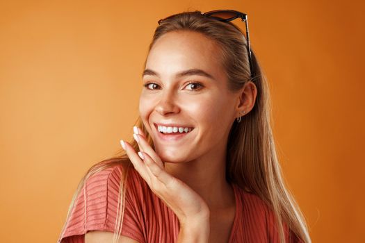 Portrait of a young beautiful happy caucasian woman smiling