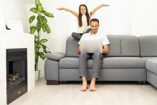 Family shopping online. Happy family smiling while sitting on the couch and shopping online together