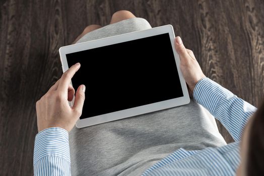 close-up of female hands with a computer tablet