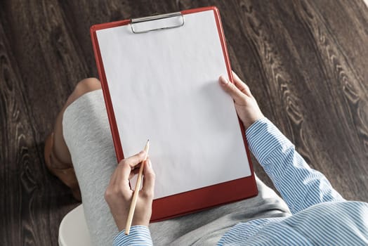 close-up a female hands with tablet and pencil