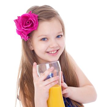 girl, fashion, rose in her hair and orange juice in a glass- Portrait of happy little girl drinking orange juice