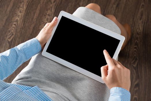 close-up of female hands with a computer tablet