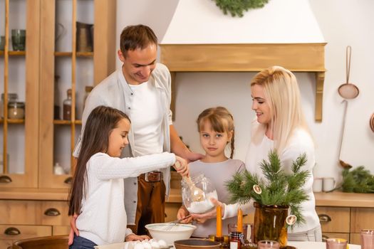 happy sisters children girls two little girls cooking before christmas in the kitchen