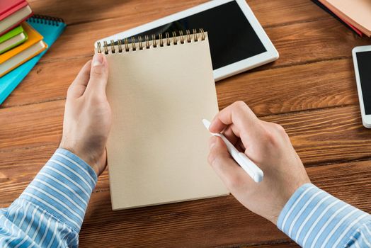 close-up of hands with notepad. office work