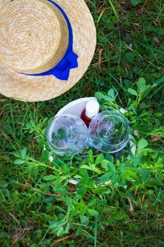 glasses in a wooden bucket on grass. Picnic. Summer