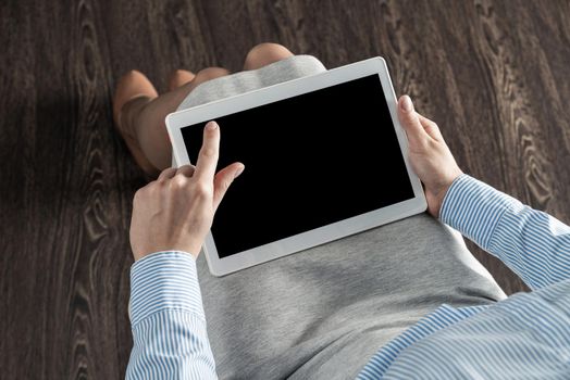 close-up of female hands with a computer tablet