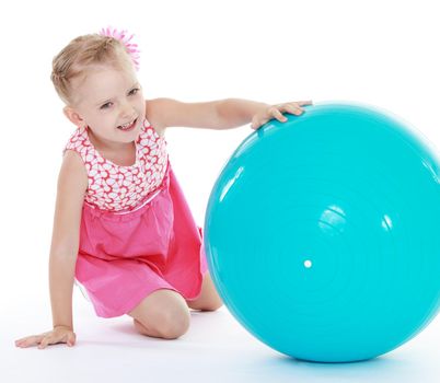 Cheerful girl plays with a big ball for fitness.Isolated on white background .
