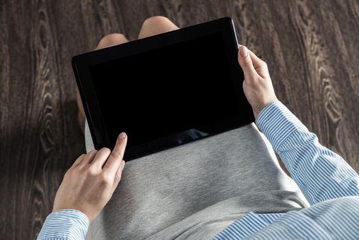 close-up of female hands with a computer tablet