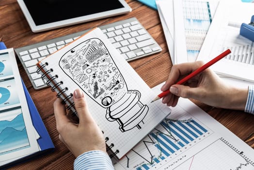 close-up, woman draws business notes in her notebook. Business Innovation Concept