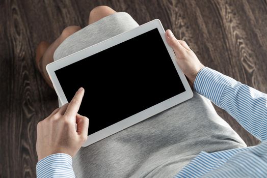 close-up of female hands with a computer tablet