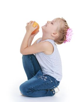 little girl with orange in hands. Isolated on white background .