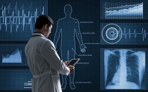 The doctor works with a virtual interface. The use of digital technology in medicine