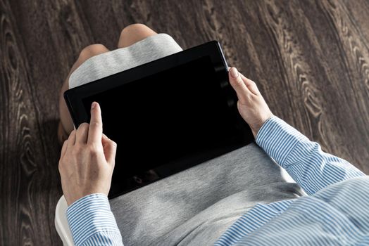 close-up of female hands with a computer tablet