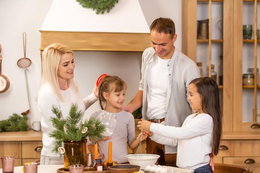 Happy family having fun at home, family cooking before christmas