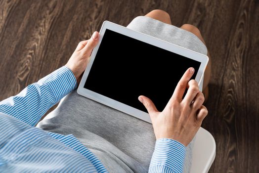 close-up of female hands with a computer tablet