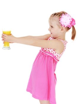 Little girl holding her at arm's length glass of orange juice. Isolated on white background .