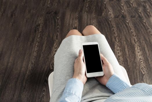 close-up of female hands with a phone