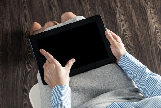 close-up of female hands with a computer tablet