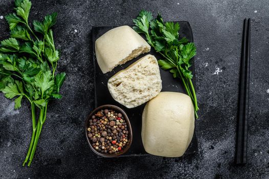 Chinese Lotus paste Steam bun. Black background. Top view.