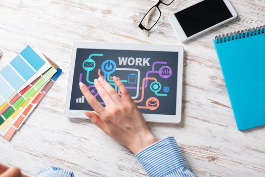 Business lady sitting at desk with tablet computer. Mobile smart devices in business processes. Business occupation and innovation. Corporate office workplace with business woman at wooden desk.