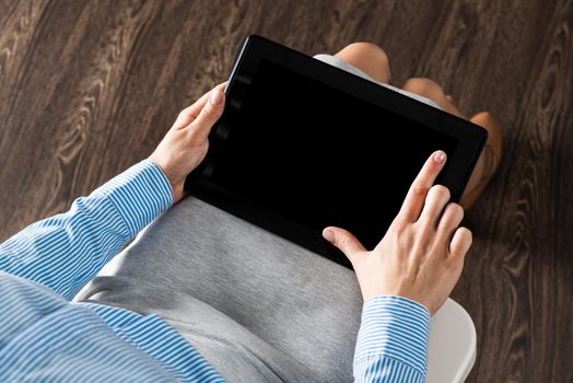 close-up of female hands with a computer tablet