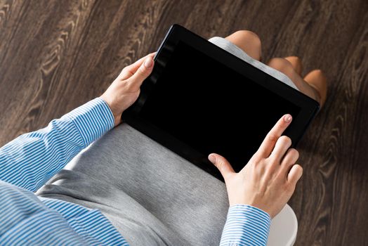 close-up of female hands with a computer tablet