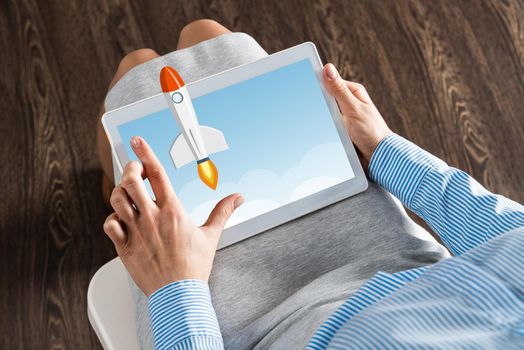 close-up of female hands with a computer tablet. Concept business startup