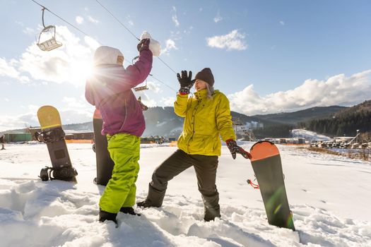 Family winter vacation in ski resort