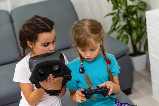 Young girls with virtual reality glasses. VR headset.