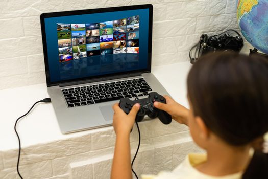 young girl playing a video game