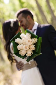 Just married couple together in poplar background