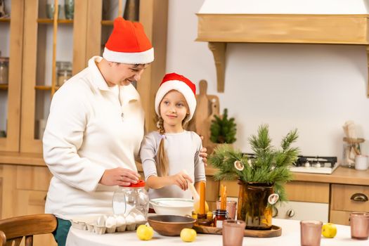 Happy family at christmas. Mother and daughter having fun at home