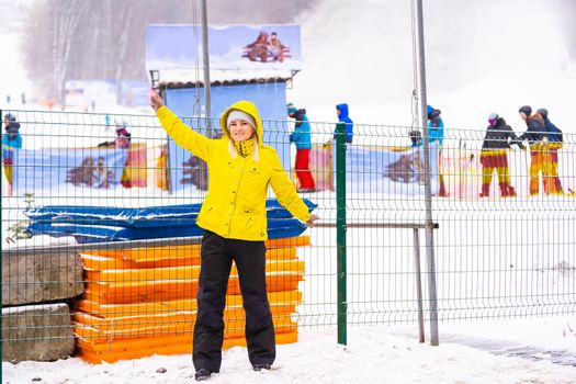 Tourists enjoy to play ski and snowboard at ski resort on holiday.