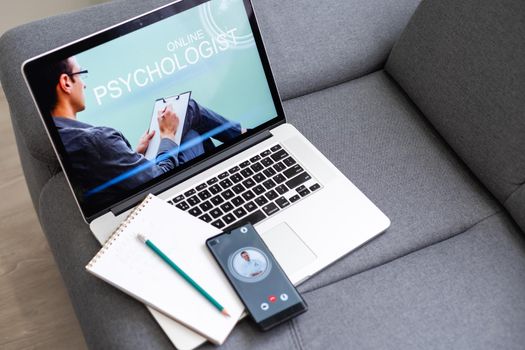 videoconferencing with psychologist doctor on laptop