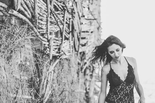 Portrait of beautiful young woman in underwear in a forest