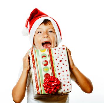 young pretty boy in santas red hat isolated on white background holding gift box close up