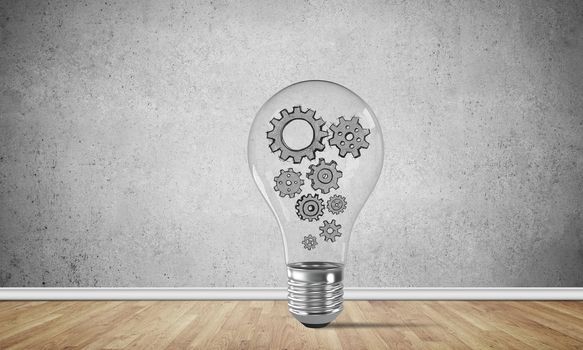 Glass lightbulb with multiple gears inside placed in empty room with grey wall on background. 3D rendering.