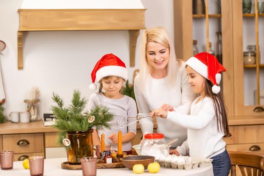 kids baking christmas cookies before the celebration of Christmas. Family