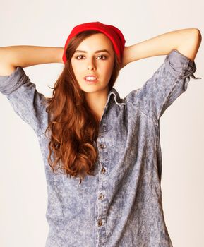 young cheerful brunette teenage girl on white background smiling