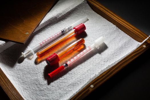 Corona virus vaccine, Covid-19 vaccine in the box. White background and syringes.